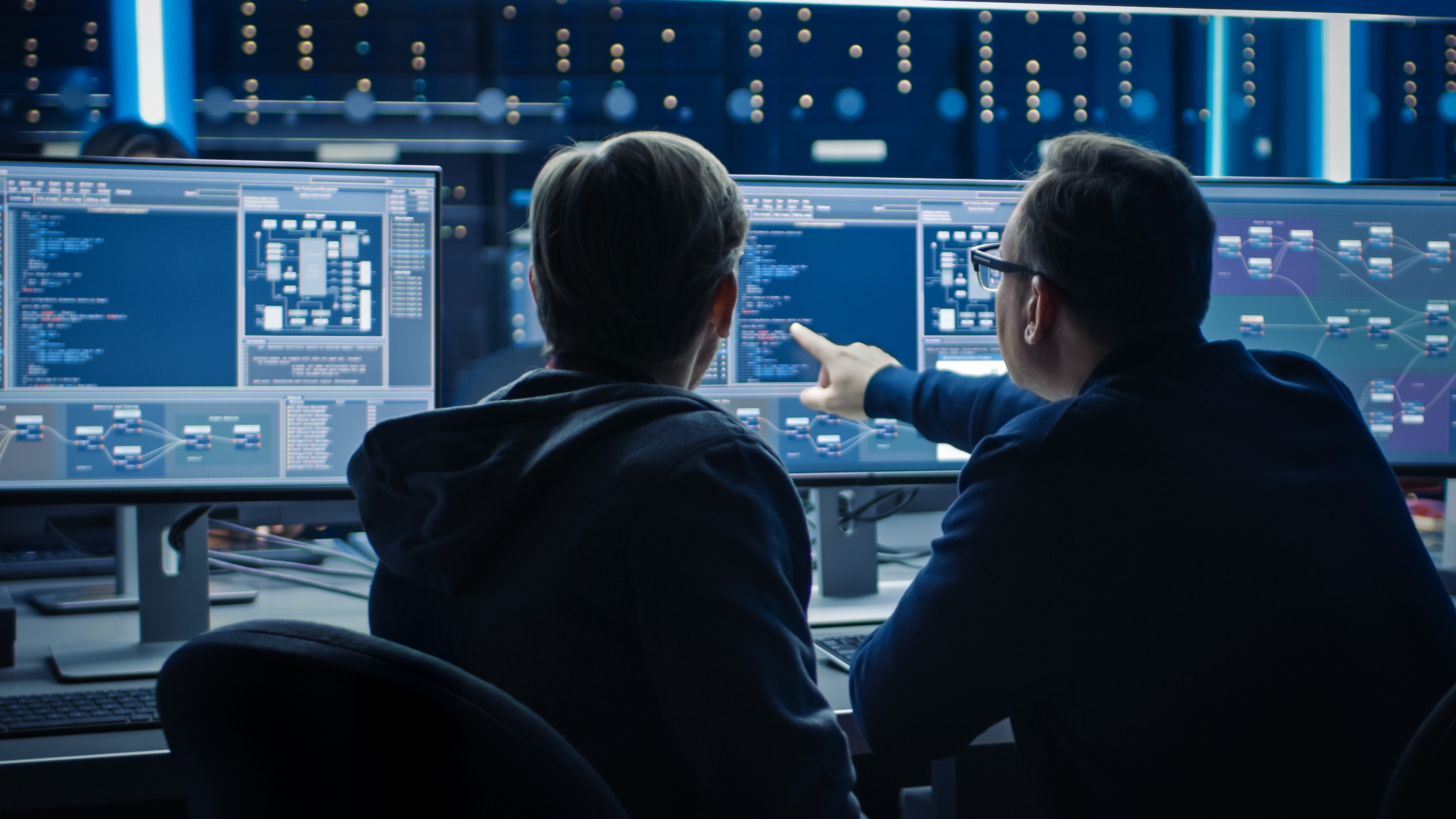 Two People sitting at computers