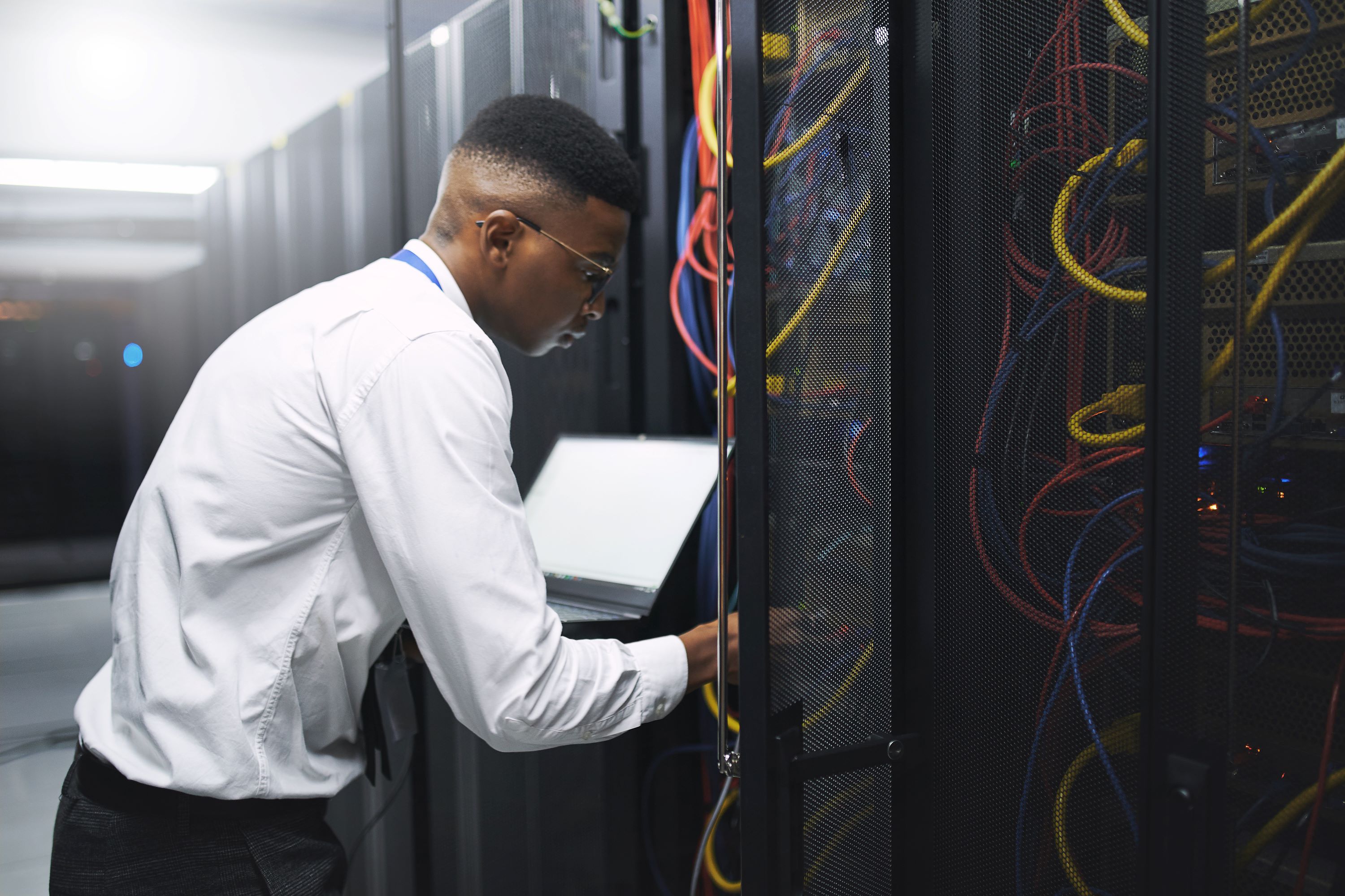 IT professional working on a server stack.