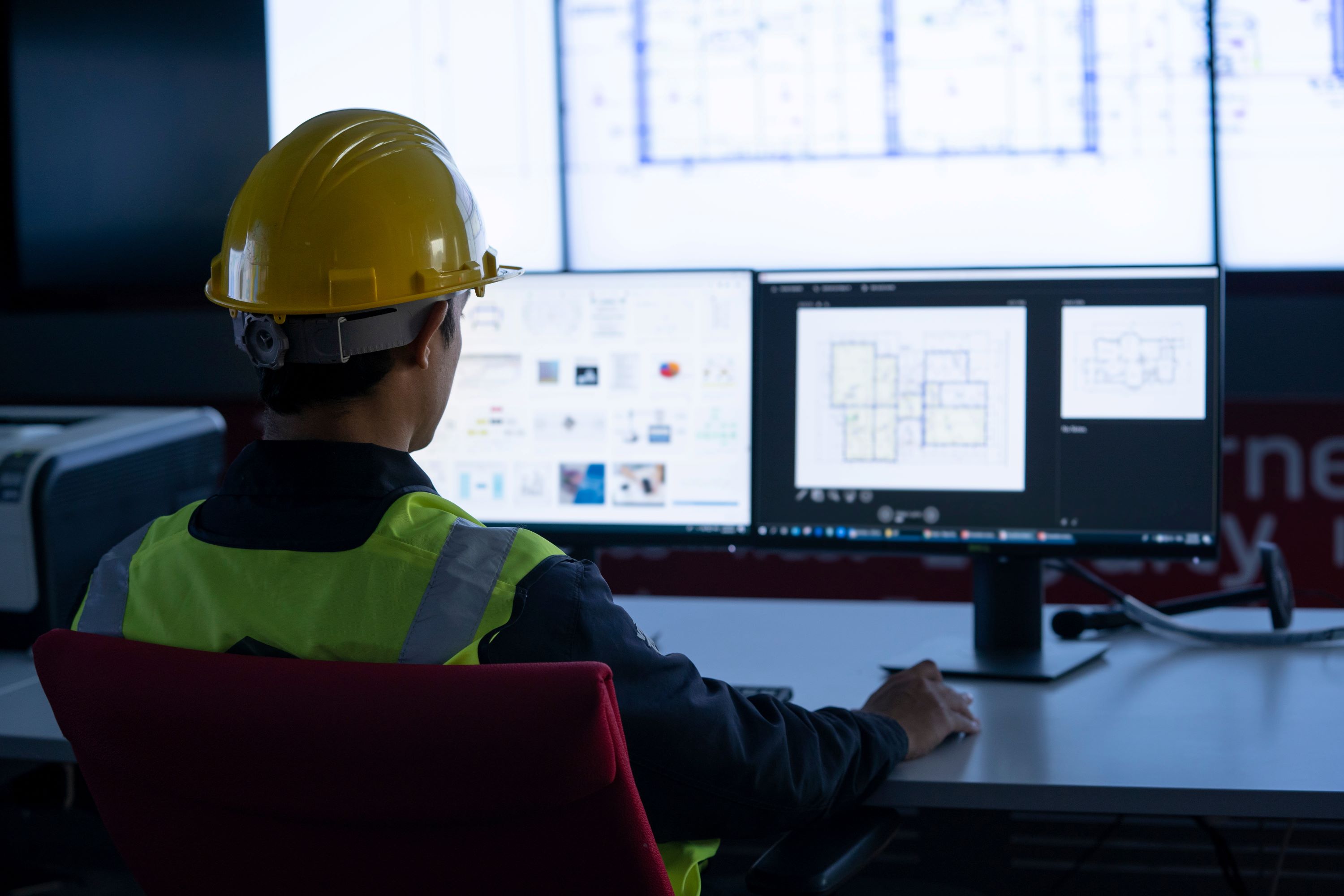 Government facilities professional working at a desktop computer